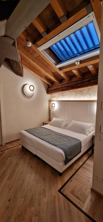 Postel nebo postele na pokoji v ubytování Cà Uberti Palace Hotel