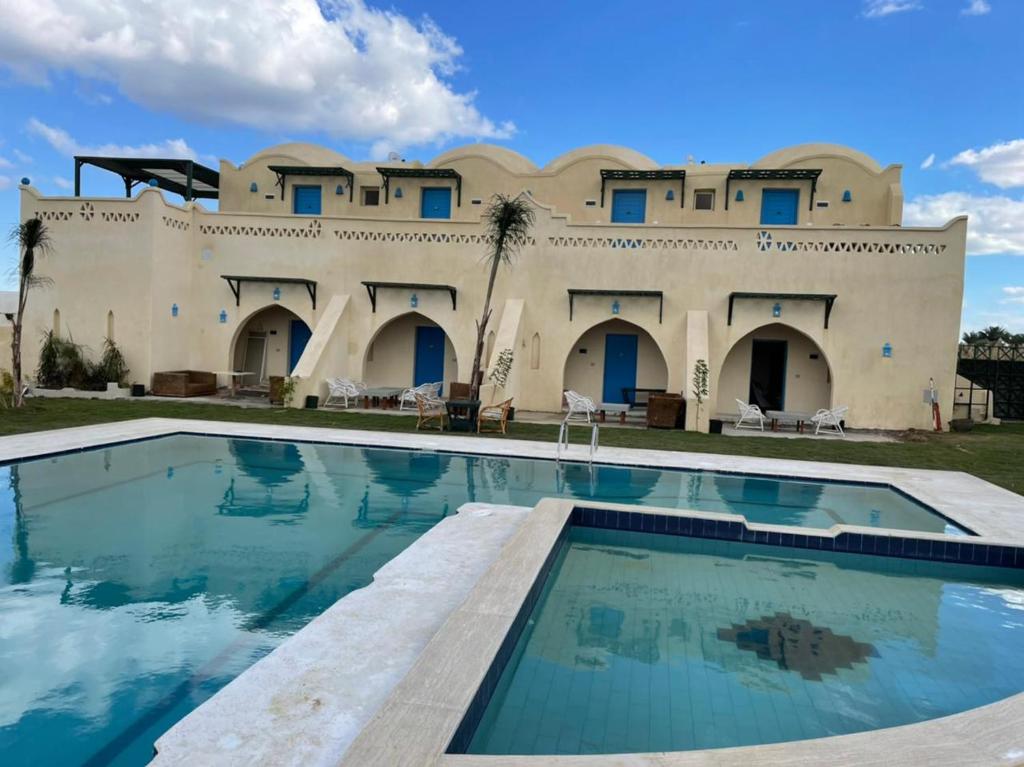 Bazén v ubytování Lake House by Tunisia Green Resort nebo v jeho okolí