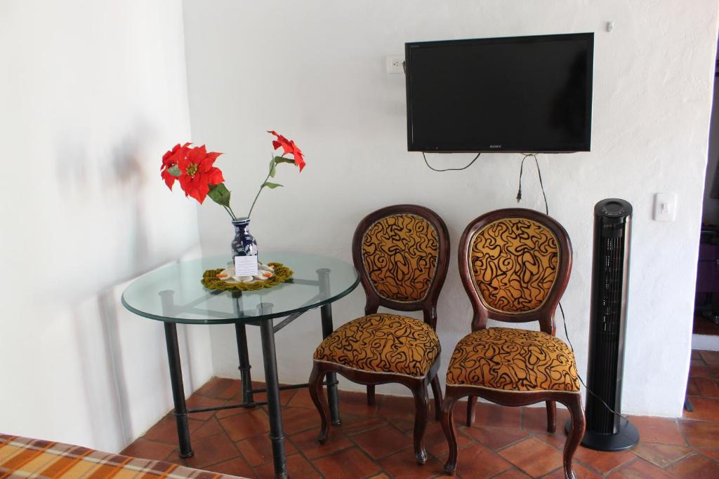 TV a/nebo společenská místnost v ubytování Casa Turistica Barichara