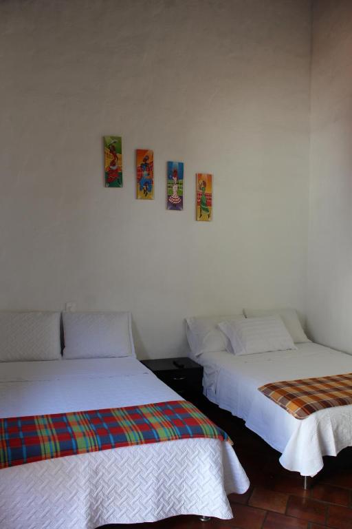 Postel nebo postele na pokoji v ubytování Casa Turistica Barichara