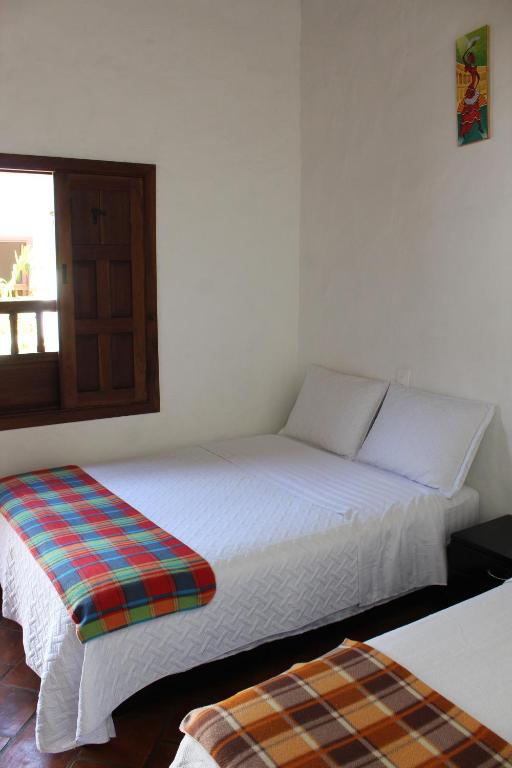 Postel nebo postele na pokoji v ubytování Casa Turistica Barichara