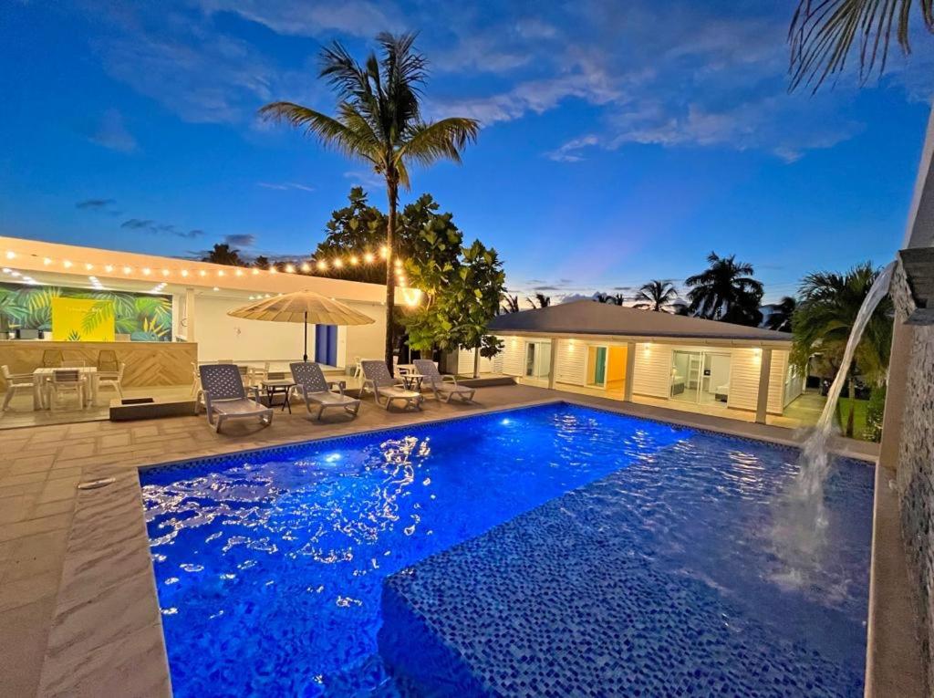 a swimming pool in the backyard of a house at Zaba Beach House in San Andrés