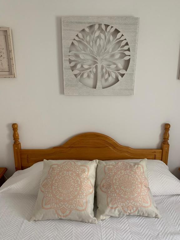 Postel nebo postele na pokoji v ubytování acogedor apartamento 2 dormitorios