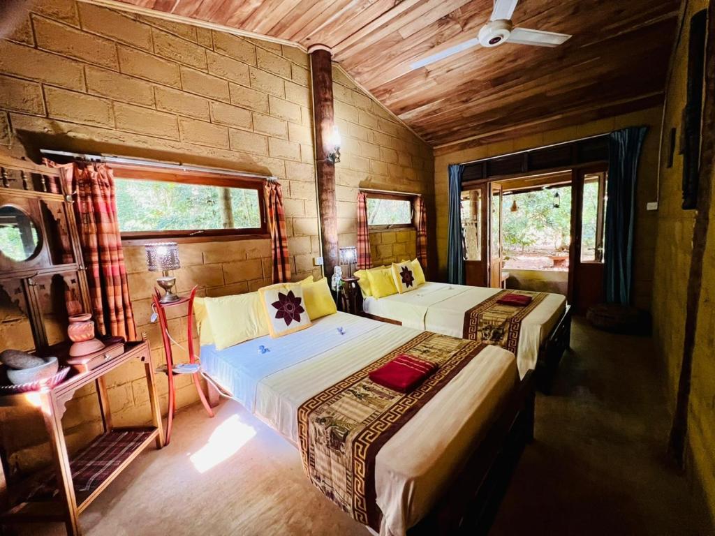 Postel nebo postele na pokoji v ubytování Kandy Eco Retreat