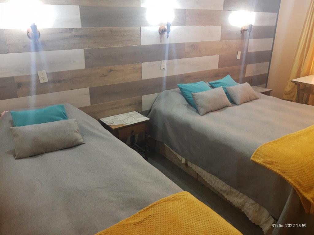 Postel nebo postele na pokoji v ubytování Hostal Klein
