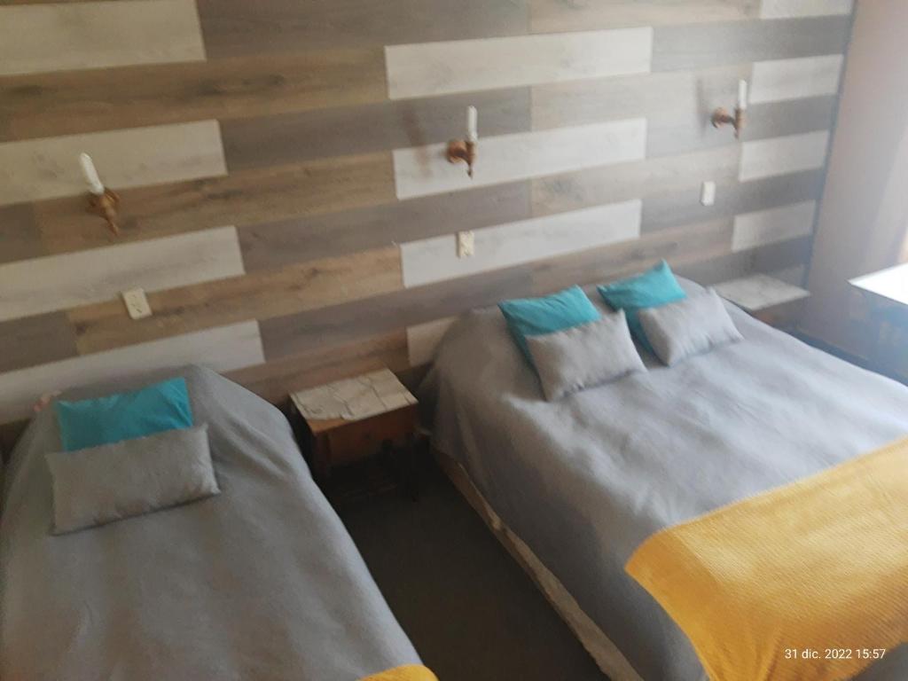 Postel nebo postele na pokoji v ubytování Hostal Klein