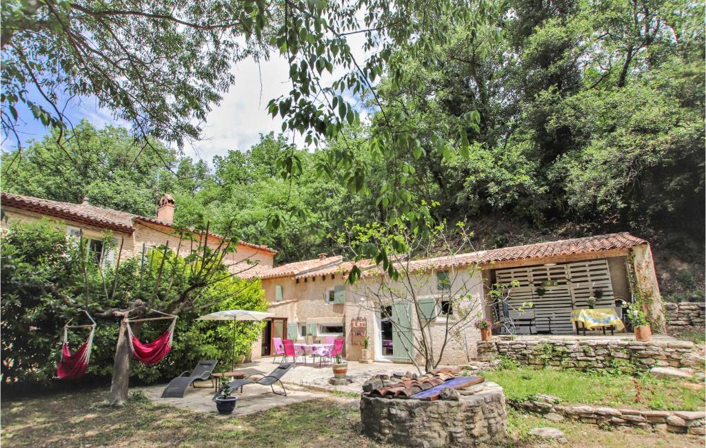an exterior view of a house with a yard at Awesome Home In Goult in Goult