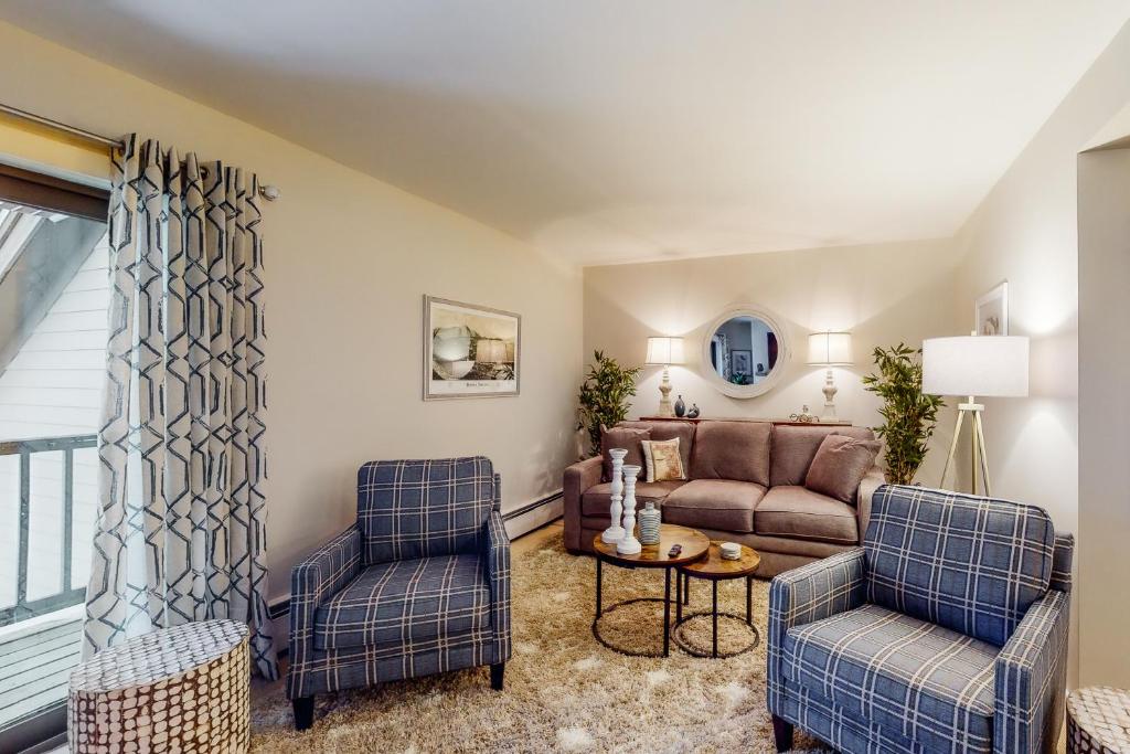 a living room with a couch and two chairs at Mountain's Edge in Brownsville