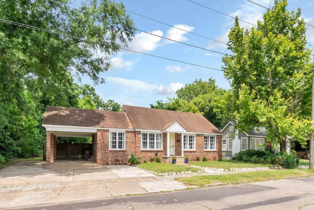 a brick house with a garage at Stylish 3 bedroom home close to downtown Mobile in Mobile