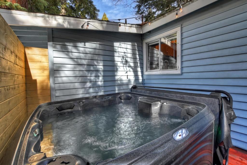 a hot tub in the backyard of a house at HOT TUB! COZY 2 bedroom mountain/lake getaway! in Running Springs