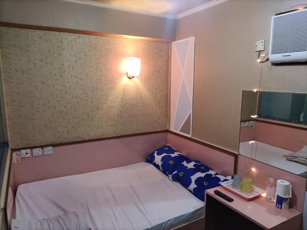 Postel nebo postele na pokoji v ubytování 嘉湖旅館