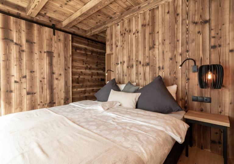 Postel nebo postele na pokoji v ubytování Chalet Tschogerhof Tiers am Rosengarten Dolomiten