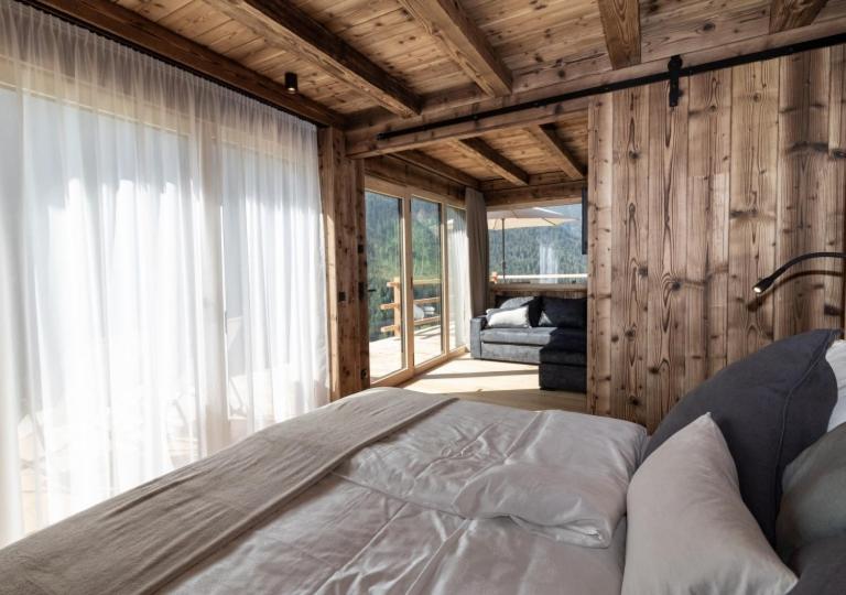 Postel nebo postele na pokoji v ubytování Chalet Tschogerhof Tiers am Rosengarten Dolomiten