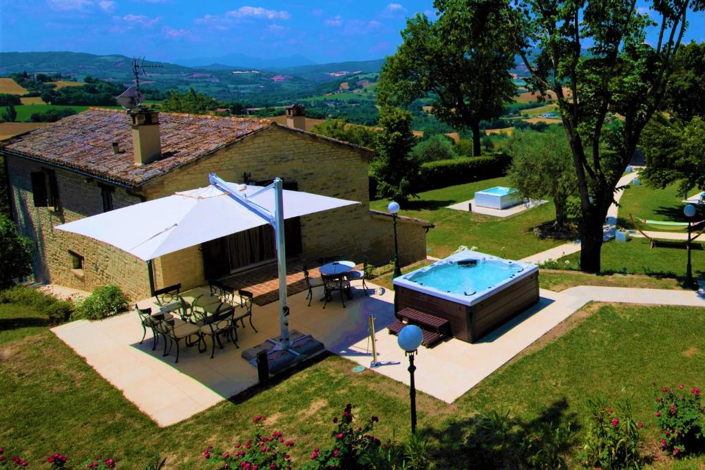 an aerial view of a house with a swimming pool at Villa Anna heated pool two outdoor jacuzzi and sauna in SantʼIppolito