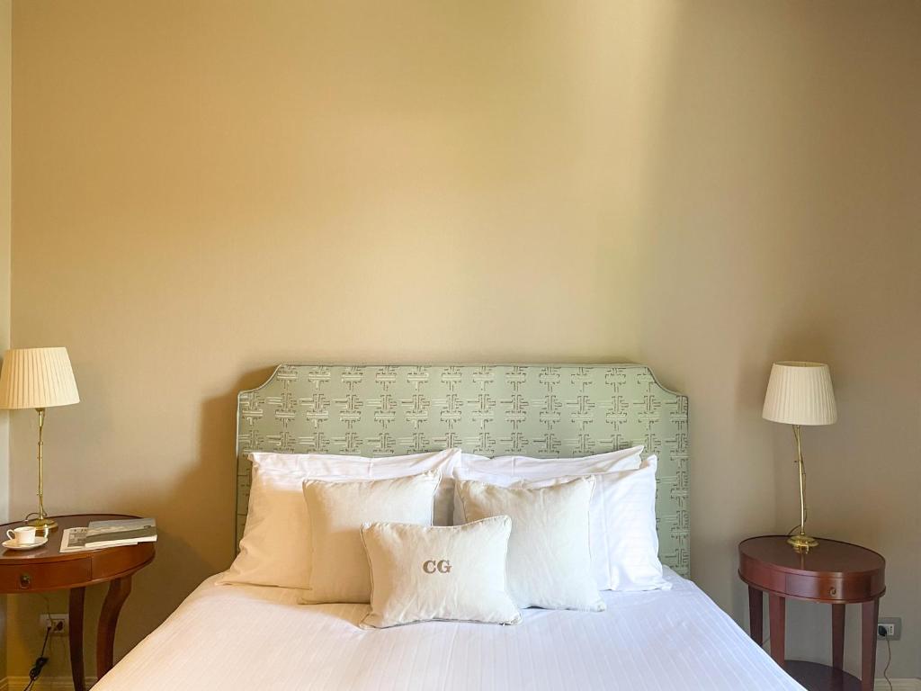 Postel nebo postele na pokoji v ubytování Corte Gondina Boutique Hotel