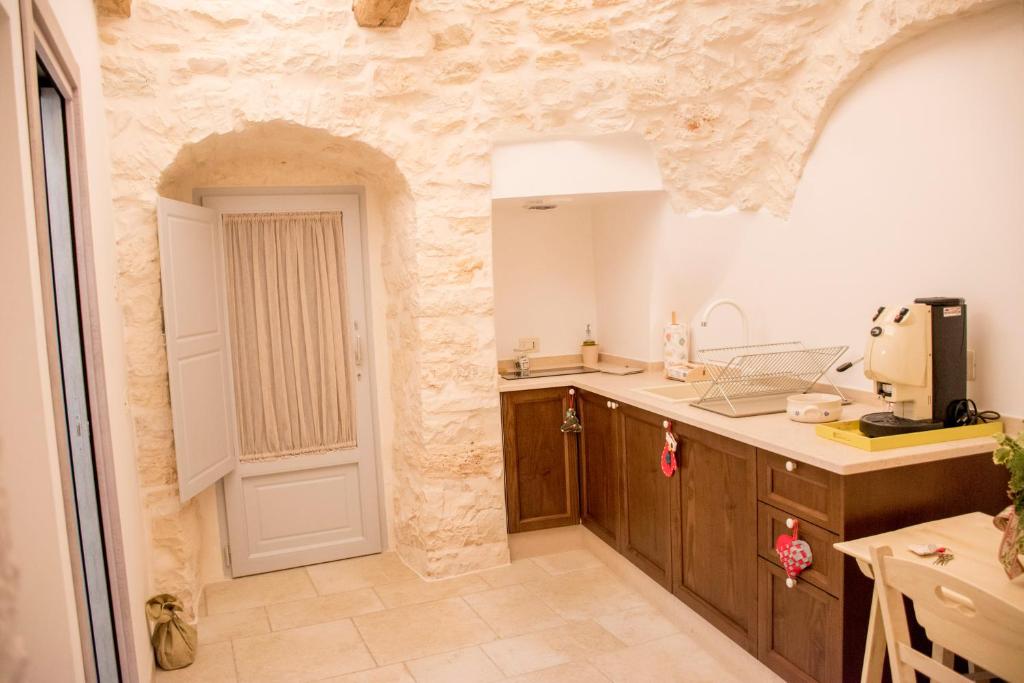 A kitchen or kitchenette at I trulli di Nonno Battista