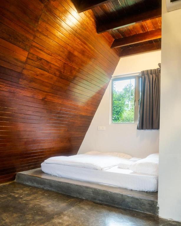 Postel nebo postele na pokoji v ubytování Durian Ecolodge
