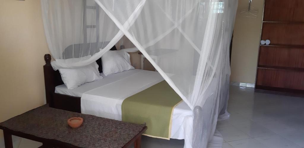 Postel nebo postele na pokoji v ubytování Armaan Guest House