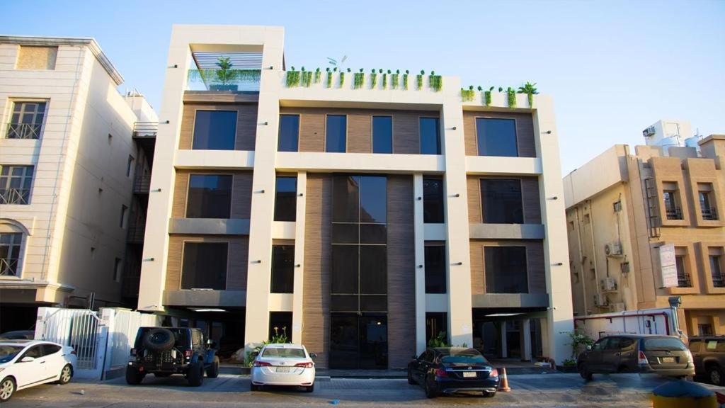 a building with cars parked in front of it at ناصرية العليا in Al Khobar