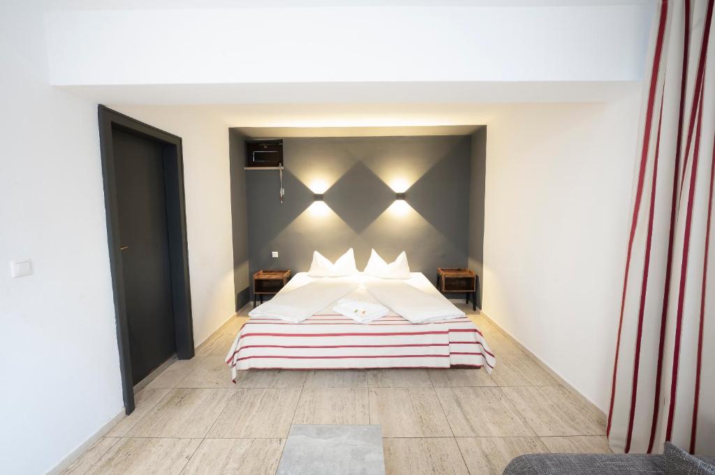 Postel nebo postele na pokoji v ubytování Hotel Astoria Stuttgart City