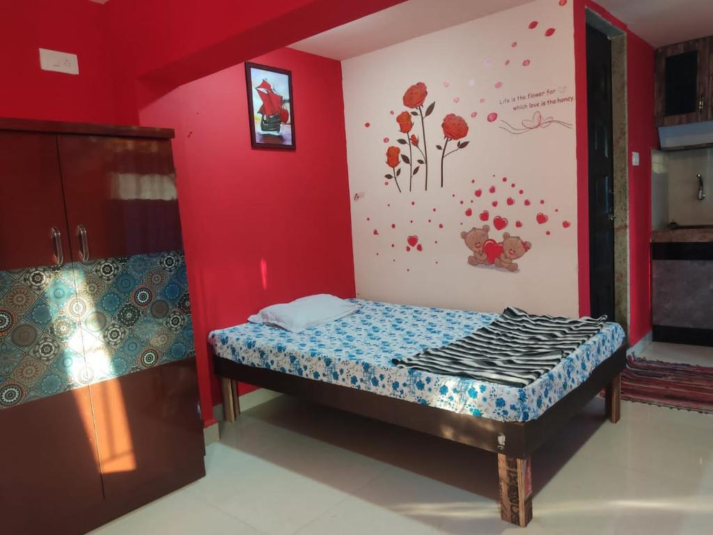 Postel nebo postele na pokoji v ubytování Godwill Kimo Guest house Seraulim