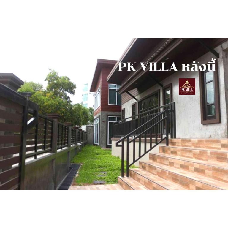a building with stairs in front of a house at PK Villa Huahin in Hua Hin