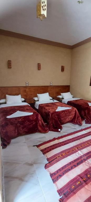 Postel nebo postele na pokoji v ubytování Nour El Waha Hotel
