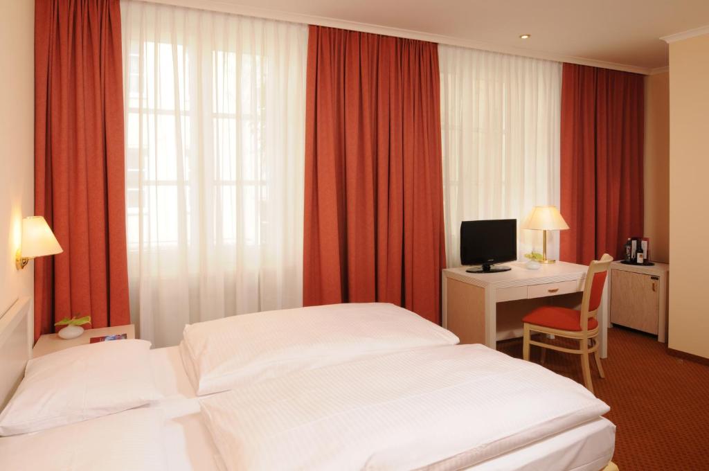 Postel nebo postele na pokoji v ubytování martas Hotel Albrechtshof Berlin
