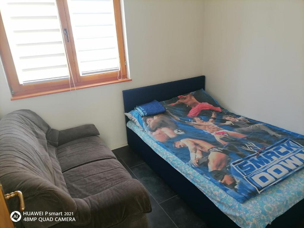 Postel nebo postele na pokoji v ubytování Guesthouse Behar