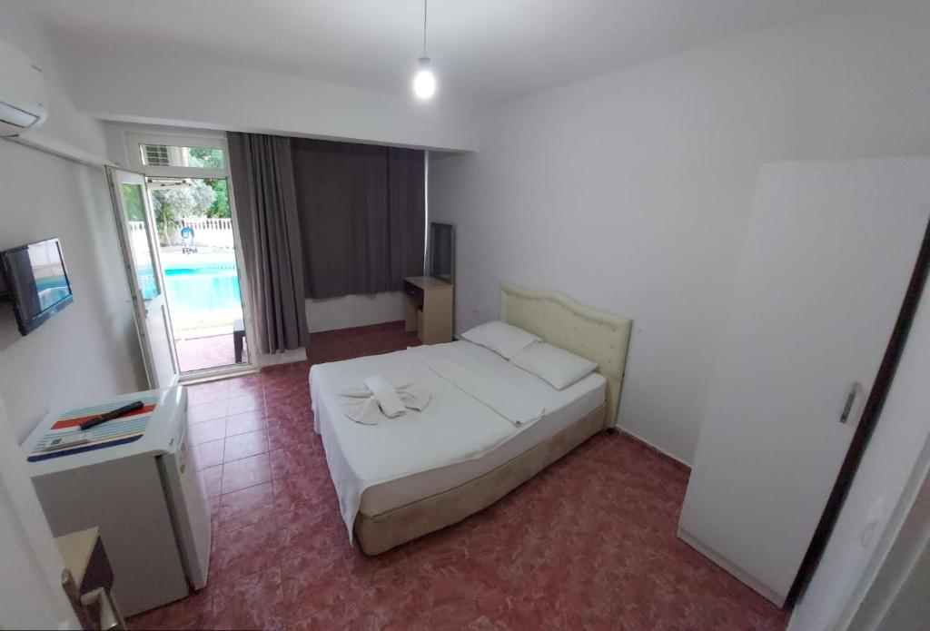 Postel nebo postele na pokoji v ubytování Şato Apart Hotel