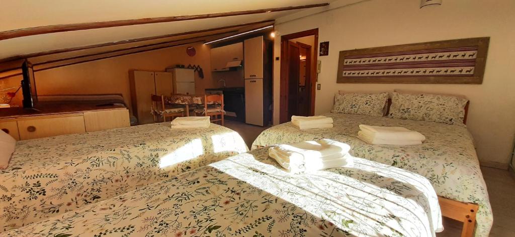Posteľ alebo postele v izbe v ubytovaní Casetta all'Abetone Jacopo e Sabrina