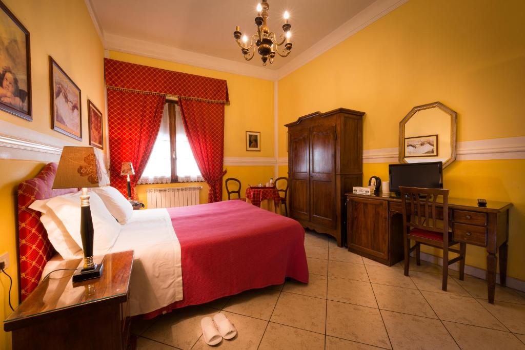 Televízia a/alebo spoločenská miestnosť v ubytovaní B&B Old Florence Inn