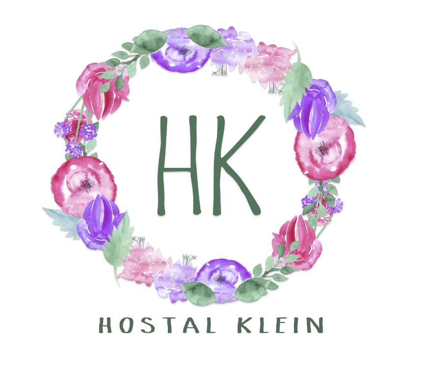 a watercolor floral wreath of flowers in the form of a hk initial at Hostal Klein in Puerto Varas