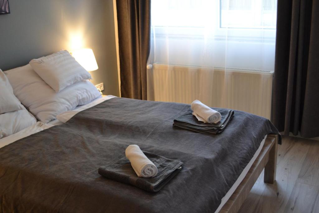 Postel nebo postele na pokoji v ubytování Főnix Design Rooms