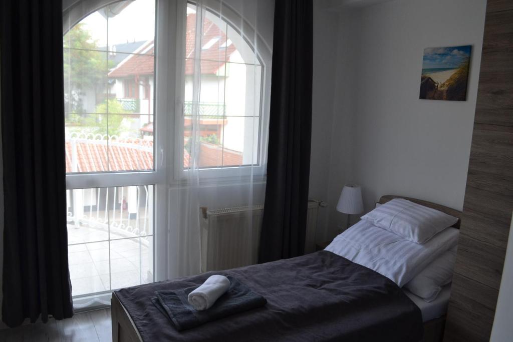 Postel nebo postele na pokoji v ubytování Főnix Design Rooms