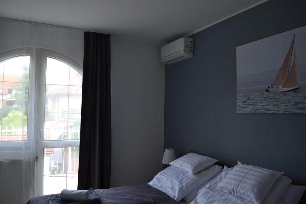 Postel nebo postele na pokoji v ubytování Főnix Design Rooms