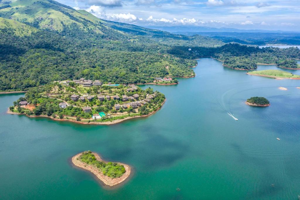 an island in the middle of a large body of water at MOUNTAIN SHADOWS RESORTS in Wayanad