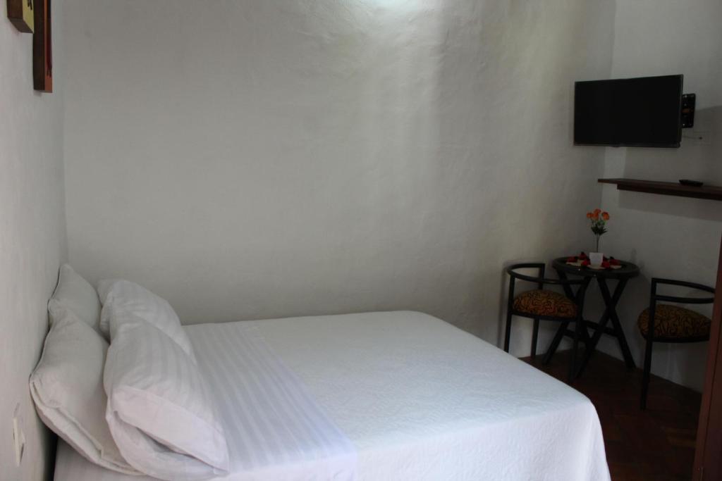 Postel nebo postele na pokoji v ubytování Casa Turistica Barichara