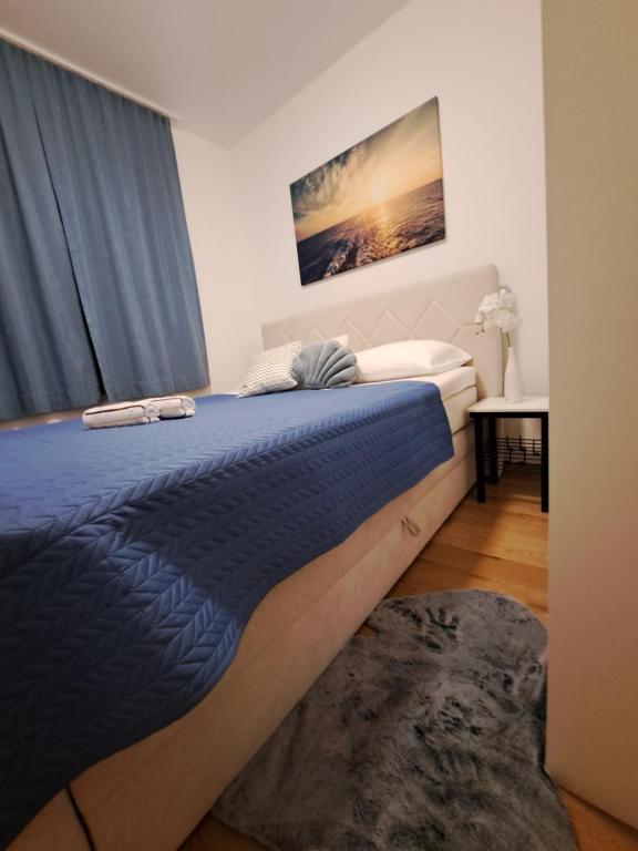 Posteľ alebo postele v izbe v ubytovaní Apartman Blue