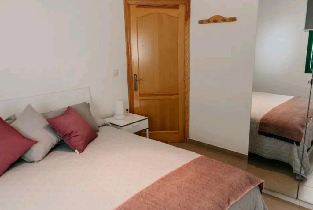Postel nebo postele na pokoji v ubytování apartment with garden a few minutes from the sea