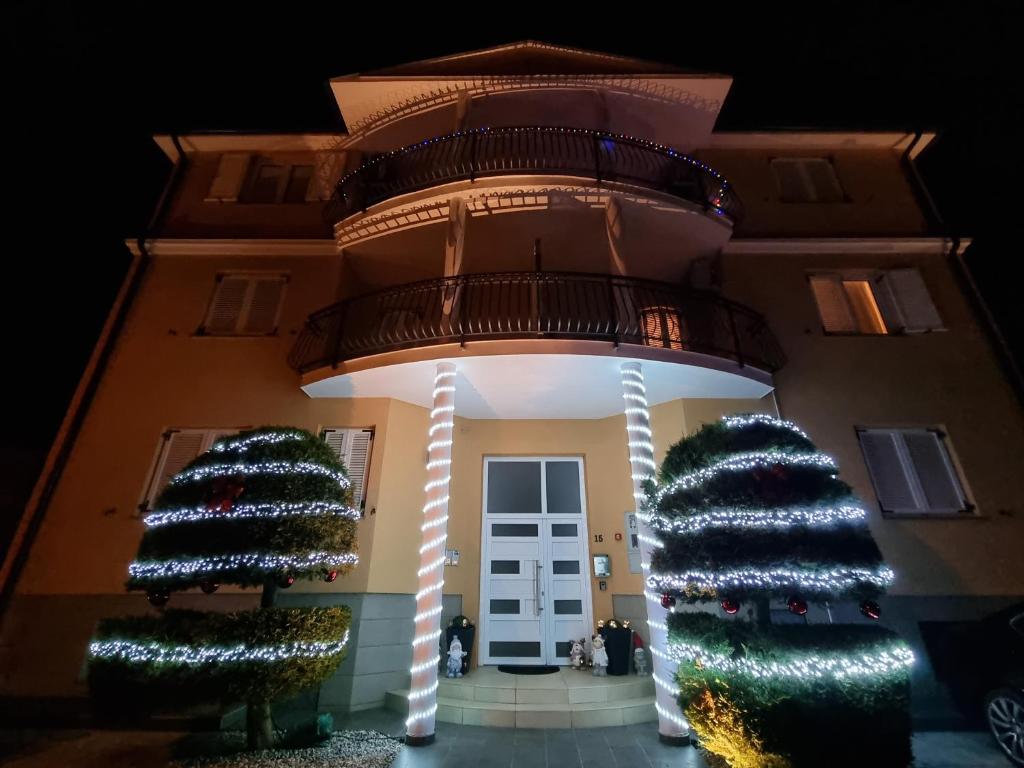 a building with a christmas tree in front of it at Apartments Medulin - Orijeta in Medulin
