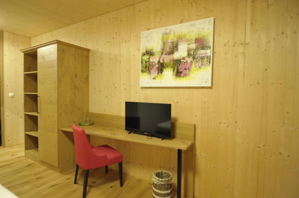 Een TV en/of entertainmentcenter bij Das Dorfhotel Engl-Grafinger
