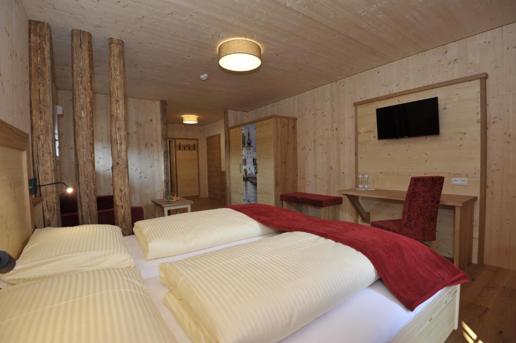 Een TV en/of entertainmentcenter bij Das Dorfhotel Engl-Grafinger
