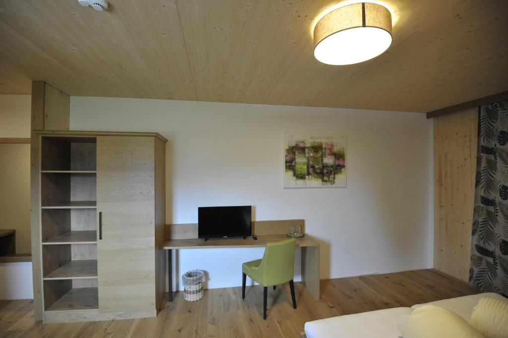 Een TV en/of entertainmentcenter bij Das Dorfhotel Engl-Grafinger
