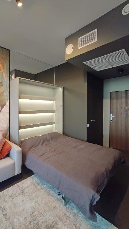 Postel nebo postele na pokoji v ubytování Hanza Tower Studio