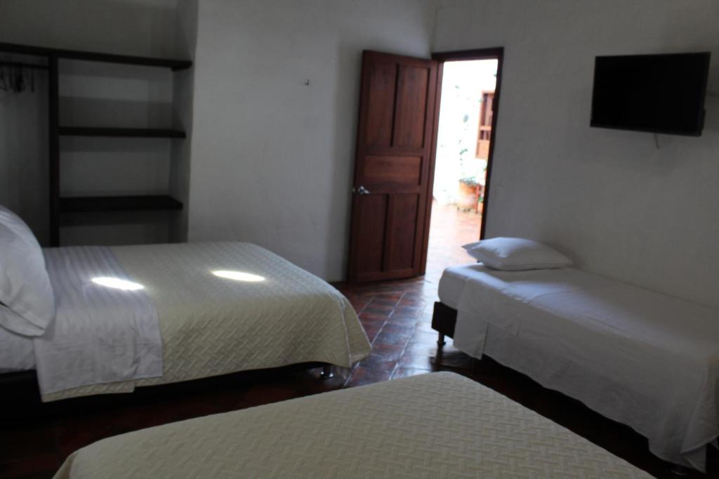 Postel nebo postele na pokoji v ubytování Casa Turistica Barichara