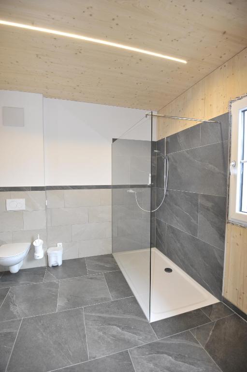 Een badkamer bij Das Dorfhotel Engl-Grafinger