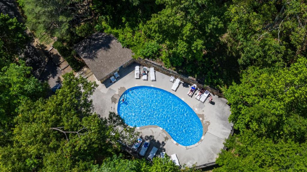 an overhead view of a swimming pool in a forest at Happy Trails - Cobbly Nob Resort Home in Gatlinburg