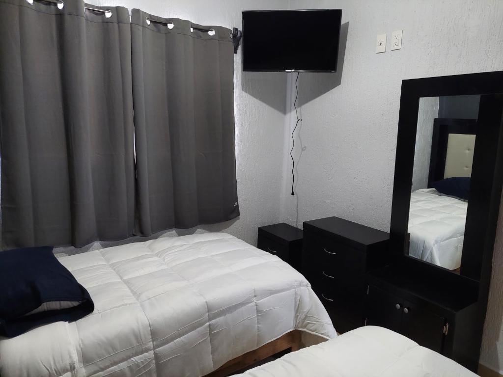 Postel nebo postele na pokoji v ubytování Casa Camichines