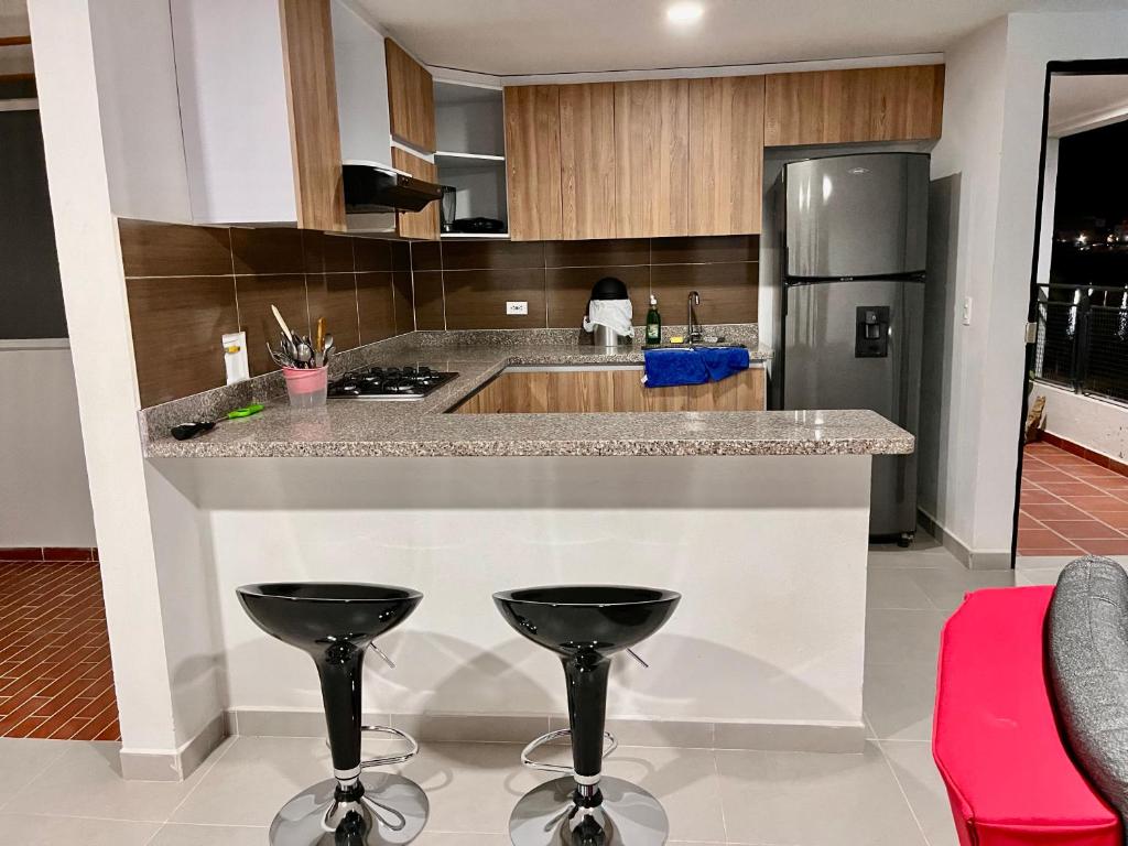 Kuchyň nebo kuchyňský kout v ubytování Travelu Guatape Apartamento